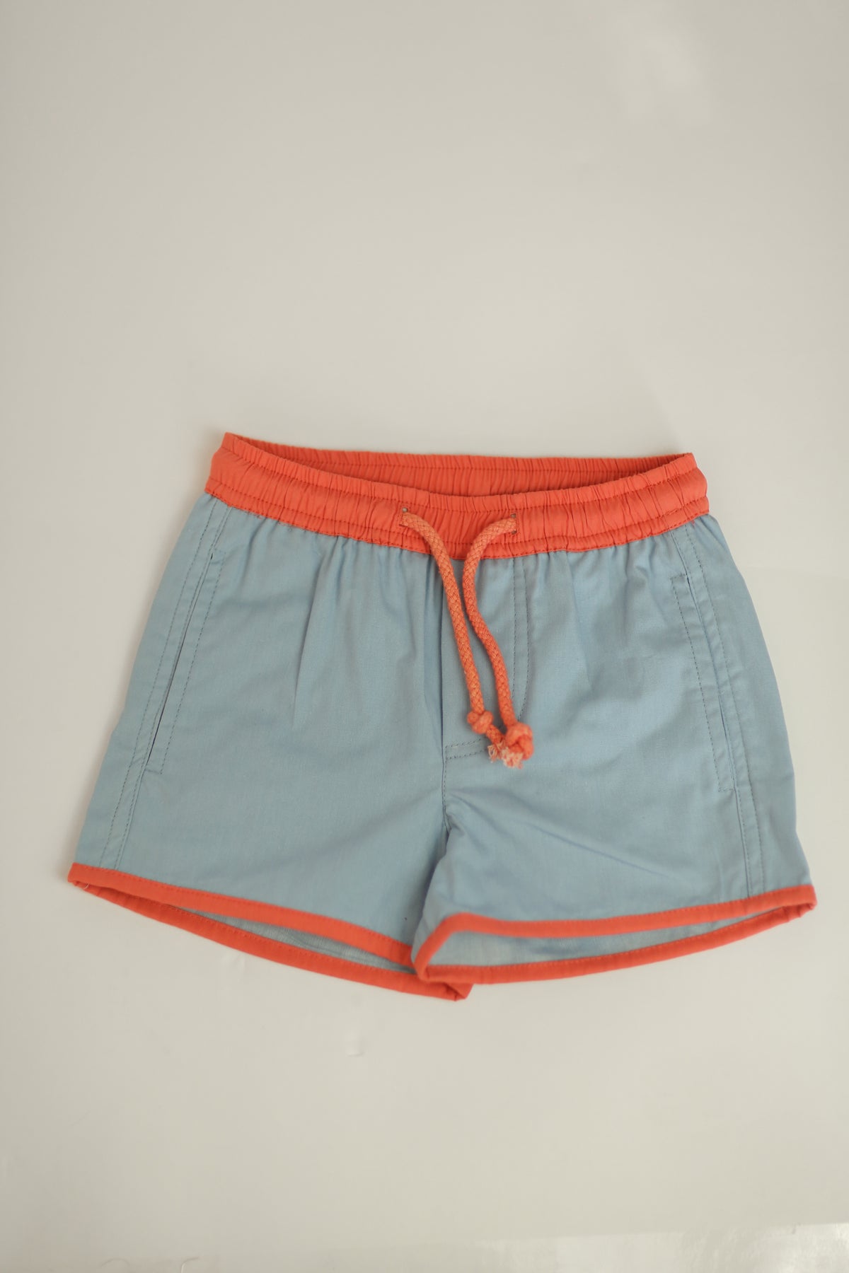 The Pop-On Short - blue w/ red trim (SS26)